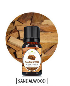 Sandalwood essential oil bottle on rustic wooden background