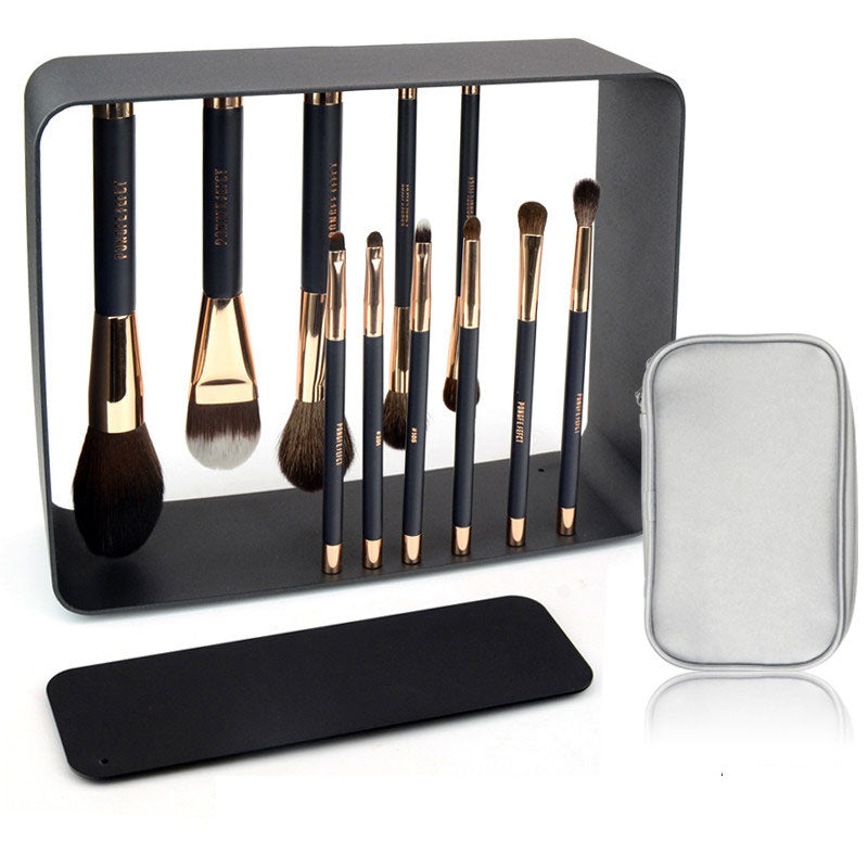 Elegant makeup brush set with real hair brushes in a stylish black holder with mirrored details. The set includes various sized brushes for different makeup application needs, presented in an organized and visually appealing manner. The included mirror and storage case provide a convenient way to transport and use this premium quality makeup brush collection.