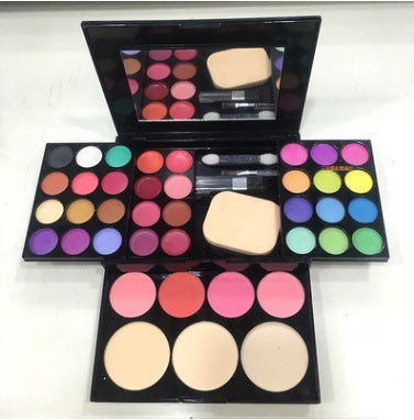 Vibrant makeup palette with array of eyeshadows, blushes, and highlighters for complete cosmetic collection