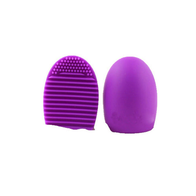 Silicone Wash Egg Make-up Brush Wash Artifact: Vibrant purple silicone makeup brush cleaning tool with textured surface and egg-shaped design.