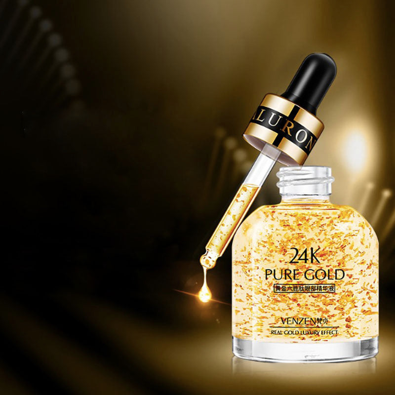 Luxurious 24K pure gold eye serum with dropper bottle on dark background.