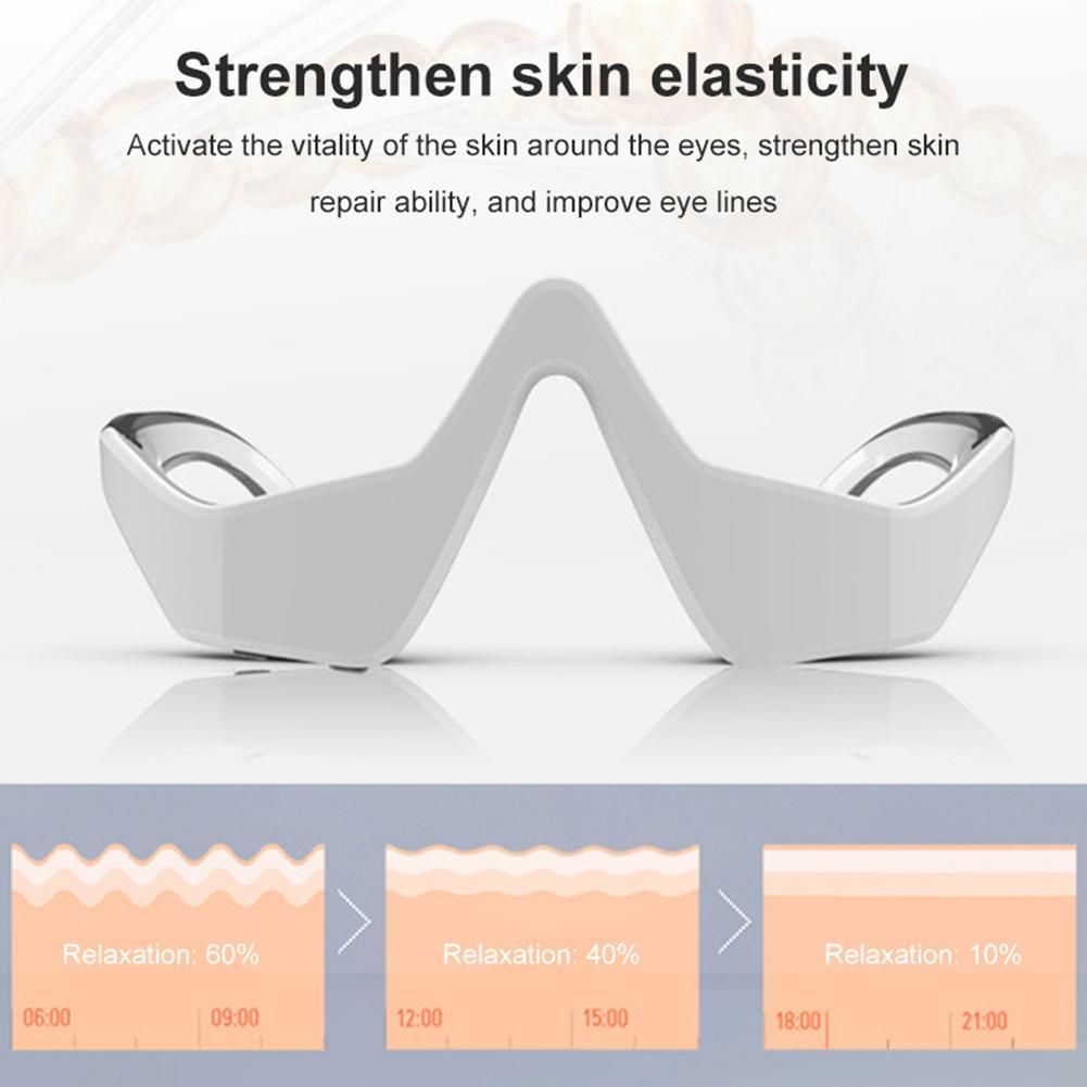 Sleek silver eye massager instrument with features to strengthen skin elasticity, activate the vitality of the skin around the eyes, and improve eye lines.