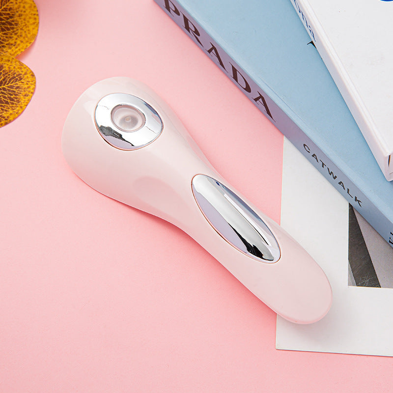 Compact handheld UV LED nail drying lamp with rechargeable design, on a pink background with magazines.