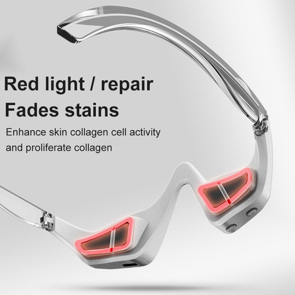 Sleek chrome 3D eye massager with red light and text describing its features: "Red light / repair, Fades stains, Enhance skin collagen cell activity and proliferate collagen"