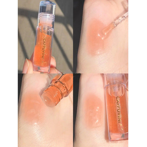 Transparent, moisturizing lip gloss in an orange-tinted bottle, capturing the product's vibrant color and hydrating formula.