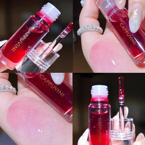 Vibrant red moisturizing lip gloss with transparent packaging showcasing the product's glossy texture and vibrant color.