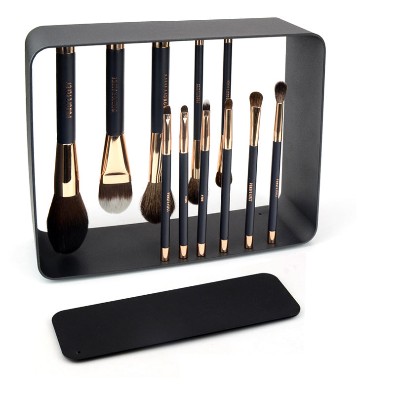 Elegant set of fashionable makeup brushes displayed in a modern black holding case