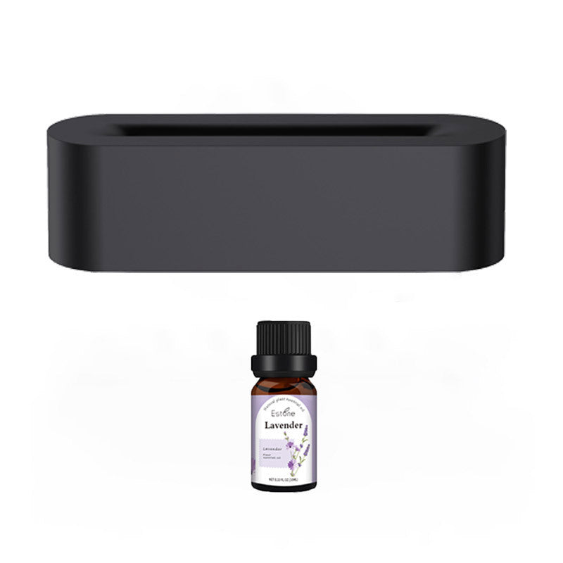 Stylish black aroma diffuser with LED lights, ultrasonic cool mist maker, and essential oil bottle