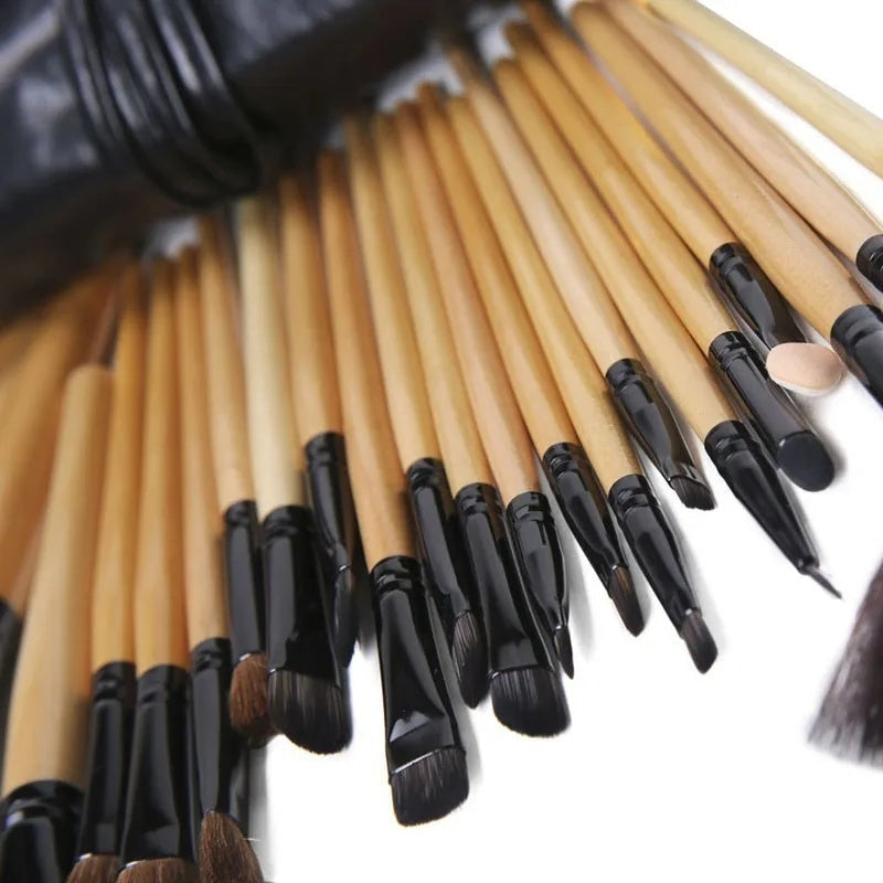 24-piece professional makeup brush set in black and yellow for cosmetic application including powder, foundation, eyeshadow, and brows.