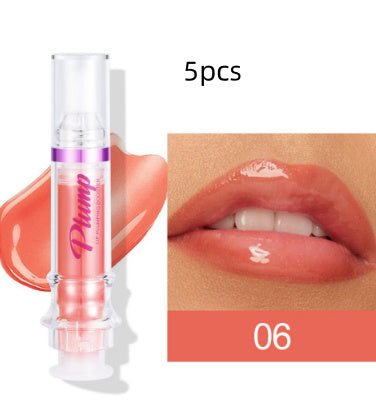 Vibrant lip colors in a glass tube, featuring a slightly spicy honey hue for a glossy, appealing pout.