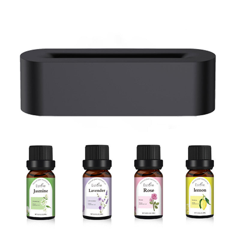 Flame Aroma Diffuser and Essential Oil Set: Compact diffuser with four essential oil bottles featuring scents like jasmine, lavender, rose, and lemon.