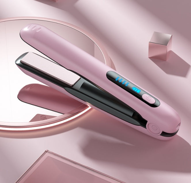 Wireless hair straightener flat iron in sleek pink design with dual roller function and 5000mAh battery, placed on a minimalist pink background.