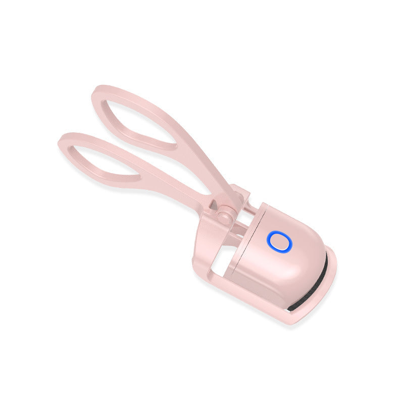 Electric heated eyelash curler with temperature control and mini design for convenient, portable eye makeup application.