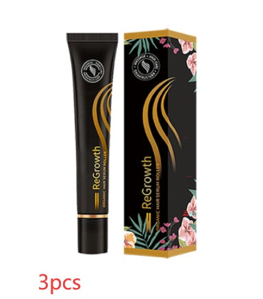 Organic hair regrowth serum in a sleek black tube with gold accents, presented in a colorful floral-patterned box for a premium beauty product.